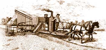 Early steam-powered harvester drawn by two horses.